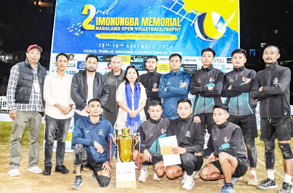 MH-10 players pose with the championship trophy after defeating Blind Spiker in the final at Public Ground, Changtongya Town, on November 15. Limanenla, Joint Secretary, Government of Nagaland, who graced the occasion, is also seen in the photo along with other dignitaries.